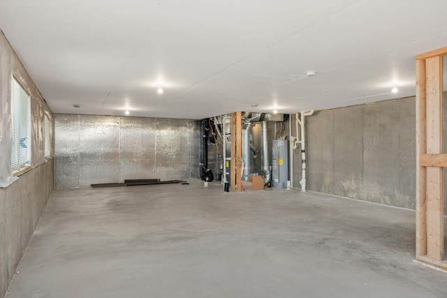 unfinished basement with electric water heater