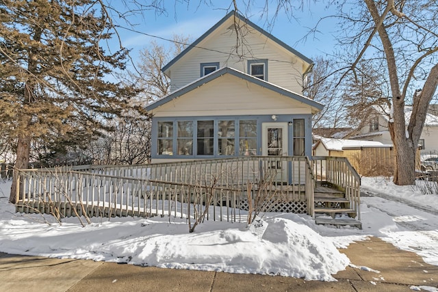 view of front facade with a wooden deck