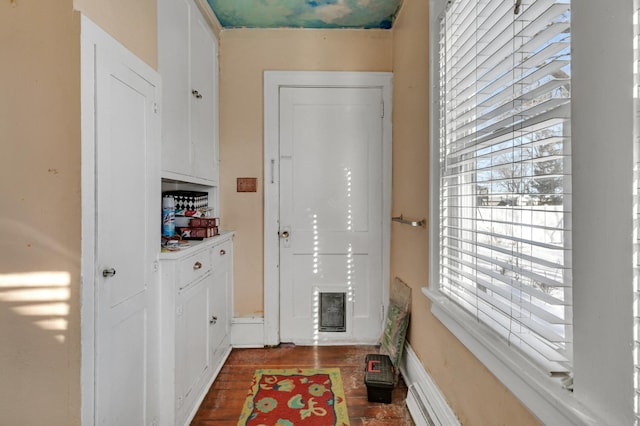 entryway featuring visible vents and dark wood finished floors