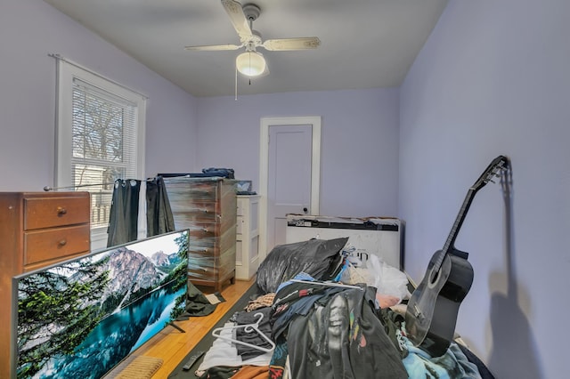 bedroom featuring ceiling fan and wood finished floors