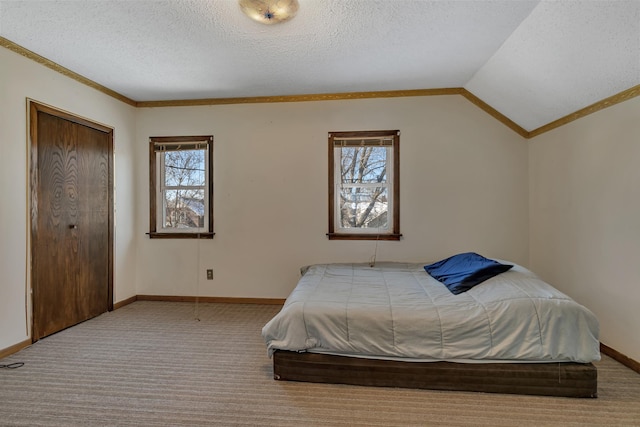 bedroom featuring light carpet, vaulted ceiling, a textured ceiling, and baseboards