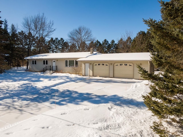 view of front of home featuring an attached garage and concrete driveway