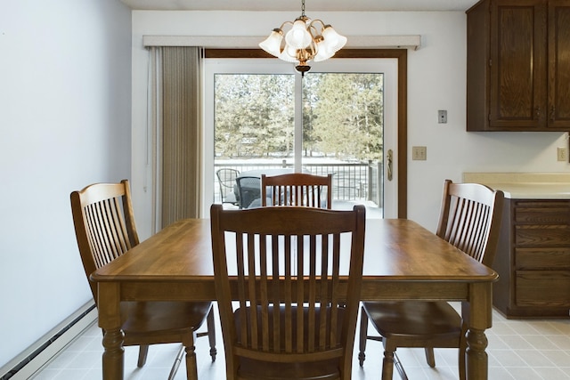 dining room featuring a chandelier and a baseboard heating unit