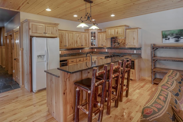 kitchen featuring white fridge with ice dispenser, wood ceiling, pendant lighting, and glass insert cabinets