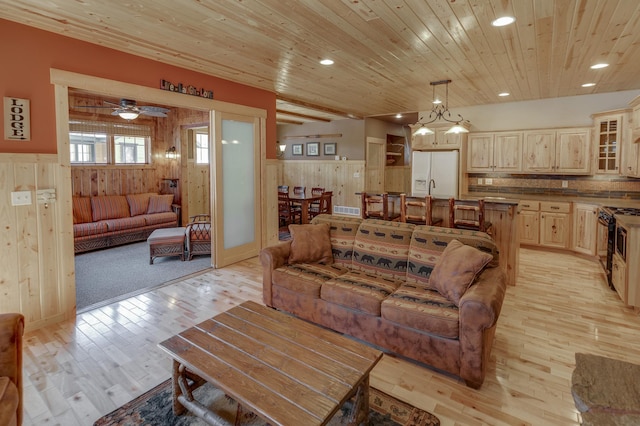 living room featuring recessed lighting, wood ceiling, a wainscoted wall, and light wood-style flooring