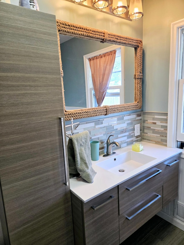 bathroom with vanity and tile walls