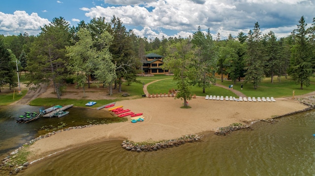 view of community with a water view and a yard