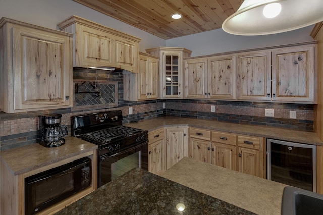 kitchen featuring wine cooler, glass insert cabinets, black appliances, light brown cabinets, and backsplash