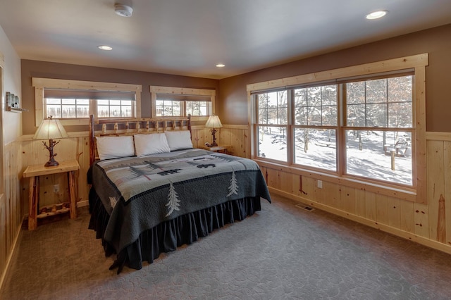 bedroom with carpet floors, a wainscoted wall, visible vents, and recessed lighting