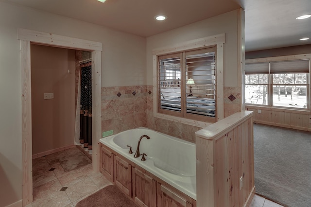 full bathroom featuring a wainscoted wall, a garden tub, and recessed lighting