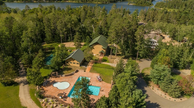 bird's eye view with a water view and a view of trees