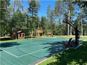 view of sport court featuring community basketball court and playground community