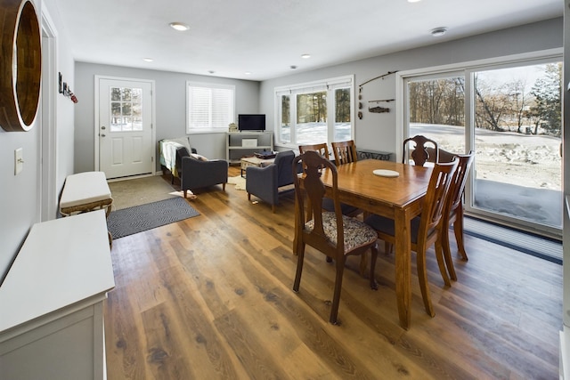 dining space featuring wood finished floors and recessed lighting