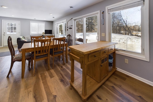 dining area featuring baseboards, dark wood-type flooring, and recessed lighting