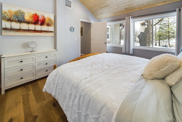 bedroom with dark wood-style floors, lofted ceiling, wood ceiling, and visible vents