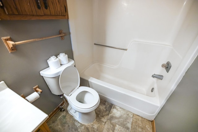 full bathroom featuring toilet and shower / bathtub combination