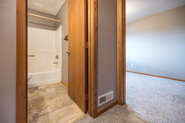 full bathroom with shower / bath combination, baseboards, visible vents, and a textured ceiling