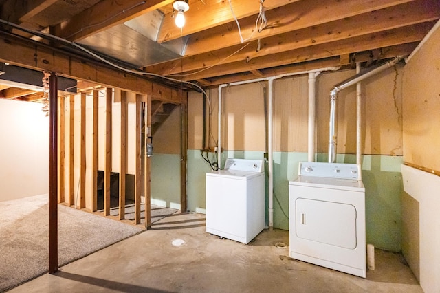 unfinished basement with separate washer and dryer