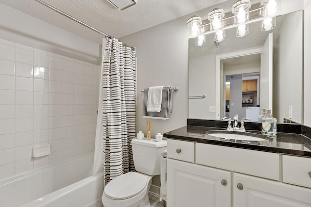 full bathroom featuring vanity, toilet, shower / bathtub combination with curtain, and a textured ceiling