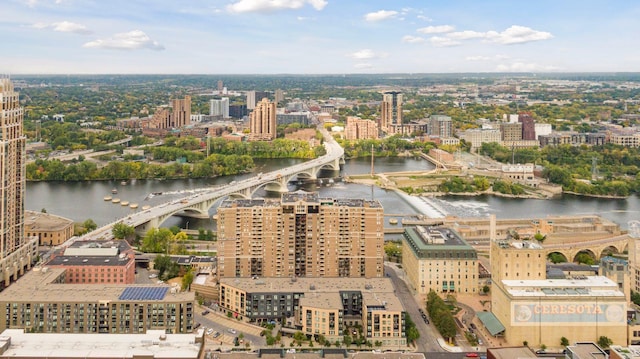 birds eye view of property with a view of city and a water view