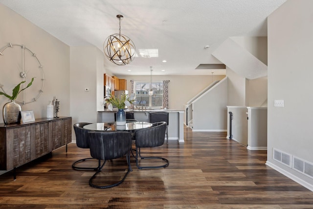 dining room featuring an inviting chandelier, stairs, baseboards, and dark wood-style flooring