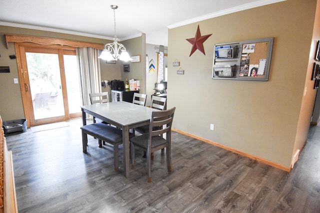 dining area with baseboards, ornamental molding, dark wood-style flooring, and an inviting chandelier