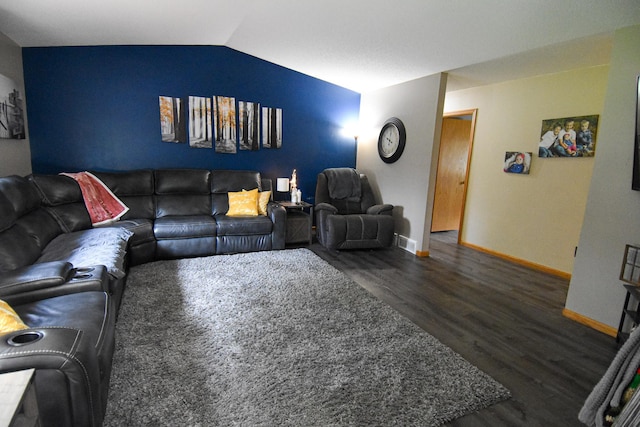 living area with lofted ceiling, baseboards, and dark wood-type flooring