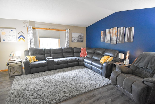 living area featuring vaulted ceiling, dark wood finished floors, and baseboards