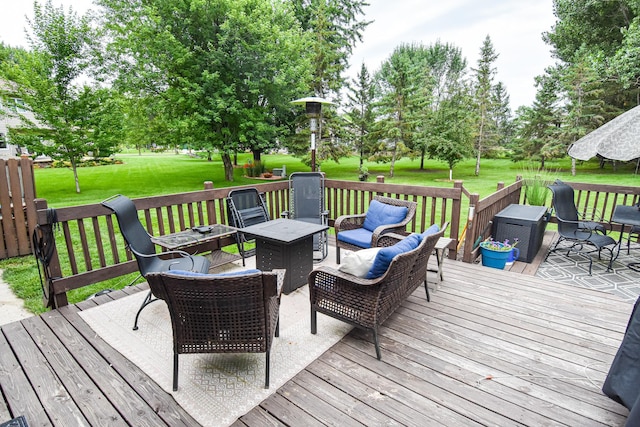 deck with an outdoor hangout area and a lawn