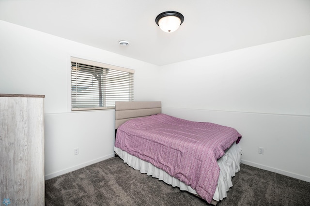 bedroom featuring carpet flooring and baseboards