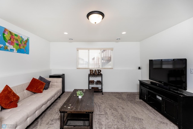 living area with recessed lighting, light colored carpet, and baseboards