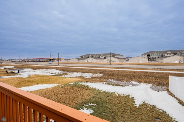 view of yard featuring a residential view and fence