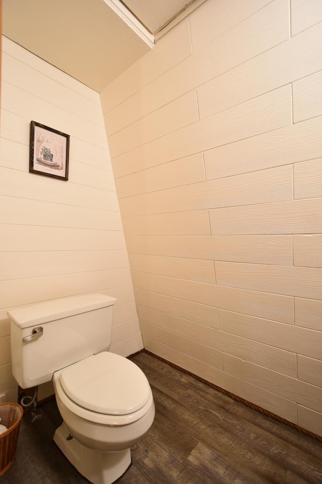 bathroom featuring toilet and wood finished floors