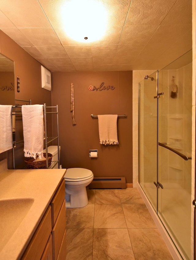 full bath with a stall shower, toilet, vanity, and baseboard heating