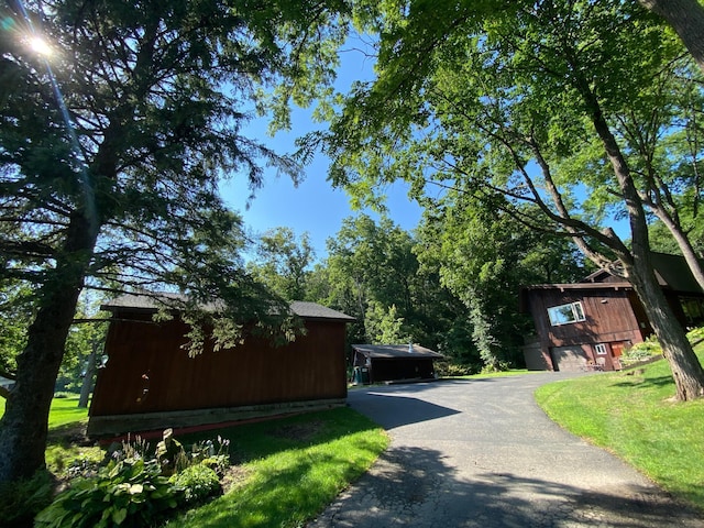 view of road with driveway