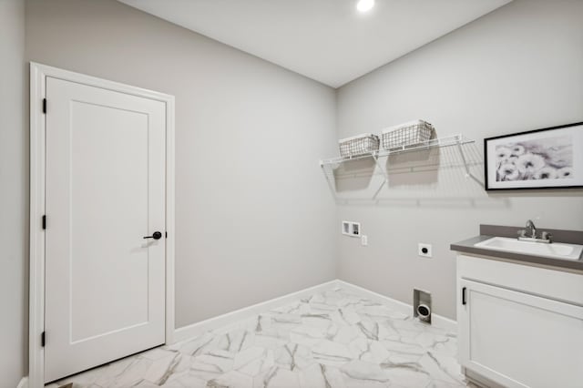 washroom with marble finish floor, a sink, electric dryer hookup, and hookup for a washing machine