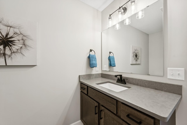 bathroom featuring vanity and baseboards