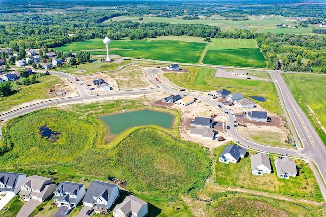 bird's eye view with a water view and a residential view