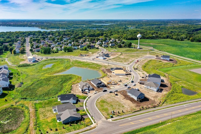 bird's eye view featuring a water view and a residential view