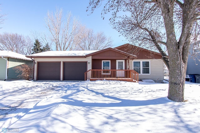 single story home with board and batten siding and an attached garage