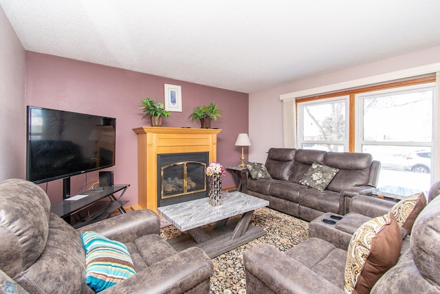 living area with a glass covered fireplace