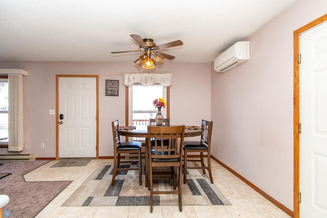 dining area with a baseboard heating unit, ceiling fan, a wall unit AC, and baseboards