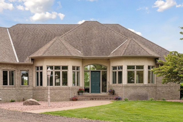 13380 Willandale Rd, Rogers, MN 55374 - rear view of property with a lawn, brick siding, and stucco siding