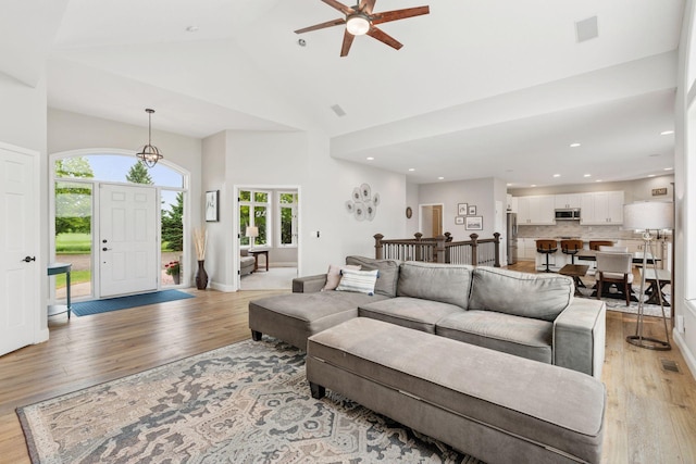 13380 Willandale Rd, Rogers, MN 55374 - living room featuring a ceiling fan, light wood-style floors, high vaulted ceiling, recessed lighting, and baseboards