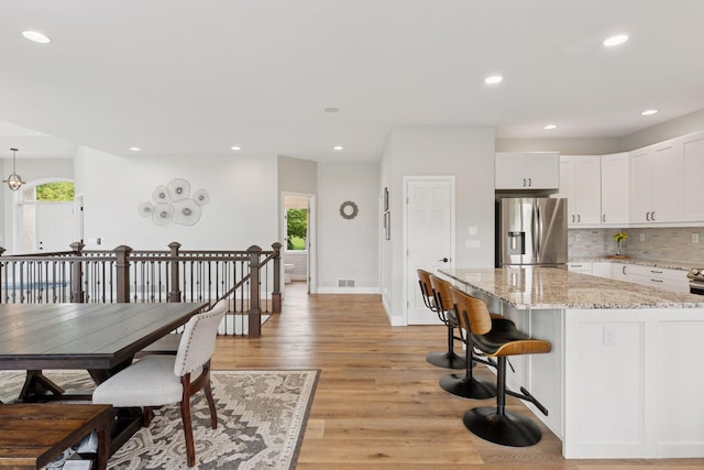 13380 Willandale Rd, Rogers, MN 55374 - dining area featuring light wood-type flooring, recessed lighting, and baseboards