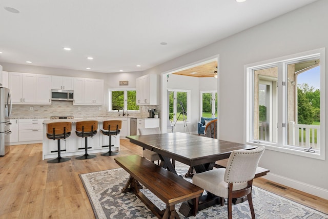 13380 Willandale Rd, Rogers, MN 55374 - dining area featuring light wood-style flooring, recessed lighting, and baseboards