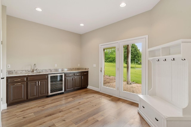 13380 Willandale Rd, Rogers, MN 55374 - indoor wet bar with wine cooler, light wood-type flooring, recessed lighting, and baseboards