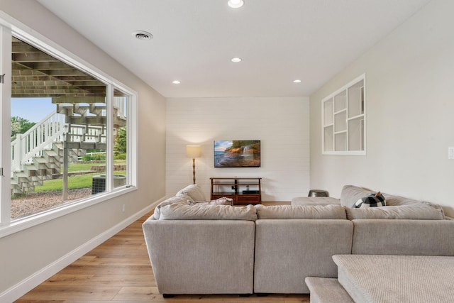 13380 Willandale Rd, Rogers, MN 55374 - living area featuring healthy amount of natural light, light wood-style flooring, recessed lighting, and baseboards