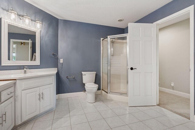 13380 Willandale Rd, Rogers, MN 55374 - bathroom with vanity, a stall shower, toilet, tile patterned flooring, and baseboards