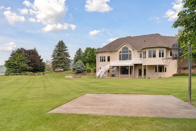 13380 Willandale Rd, Rogers, MN 55374 - rear view of house with stucco siding, stairway, a patio area, a yard, and a wooden deck